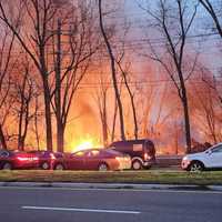 <p>Flames rise during the raging Teaneck brush fire on Tuesday, April 11.</p>