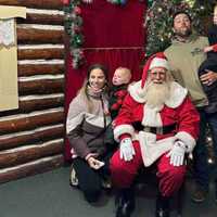 <p>Kris Muller with his family after cutting down their Christmas tree.&nbsp;</p>