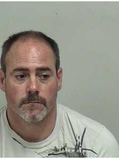 Westport Couple Charged With Slinging Arrows, Rocks Into Neighbor's Yard