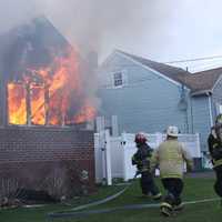 <p>Flames blew out the front windows of the Mitchell Street home in Lodi.</p>