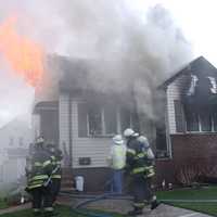 <p>Flames blew out the front windows of the Mitchell Street home in Lodi.</p>