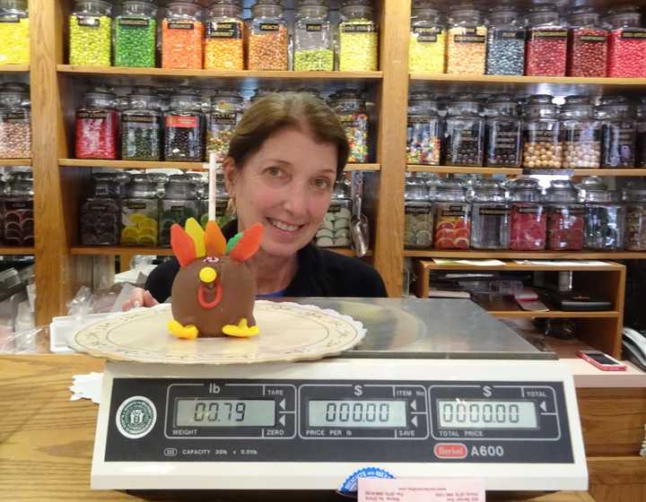 Laurie Walker shows off one of her signature &quot;Happy Apples.&quot;