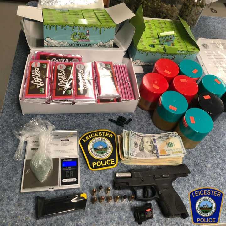 Leicester police show off the cornucopia of drugs, cash, and gun they found on a man arrested early Friday morning, May 26.