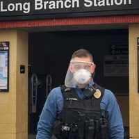 <p>A police officer at Long Branch Police Department displays one of the many COVID-19 face shield donated by Siemens Corporate Technology.</p>