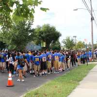 <p>The student body gathered in front of the school&#x27;s entrance.</p>