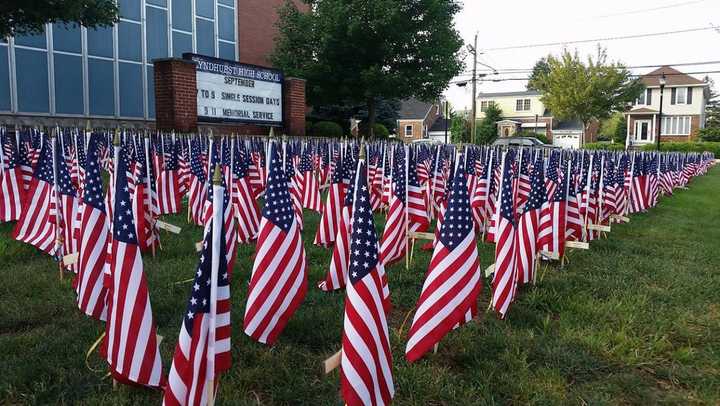 Flags were displayed across the high school lawn.