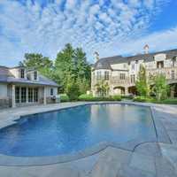 <p>The four-acre estate features a pool.</p>