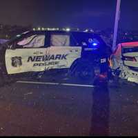 Newark Police SUV Struck By Speeding Car At Crash Scene Injuring 7