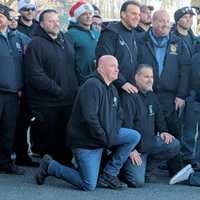 <p>Nicoletti (center left) with officers of all stripes.</p>