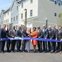 <p>State, city and county officials cut the ribbon at the official opening of Phase II of the Heritage Homes housing development in New Rochelle this week.</p>