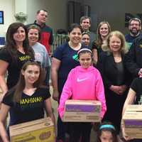 <p>Members of Mahwah&#x27;s governing body joined township Girl Scouts, who sold over 28,000 boxes of cookies this year.</p>