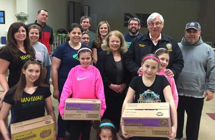 Members of Mahwah&#x27;s governing body joined township Girl Scouts, who sold over 28,000 boxes of cookies this year.