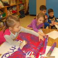 <p>Putnam Valley kindergarten students collaborate on their design on a marble project.</p>