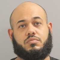 Heavily Tinted Car Windows Lead To Duo's Arrests For Weapon, Drugs On Hempstead Turnpike