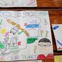 <p>A poster made by a child in the East Ramapo School District is displayed Monday at the Save the Planet Unity Celebration in Spring Valley on Martin Luther King Day.</p>