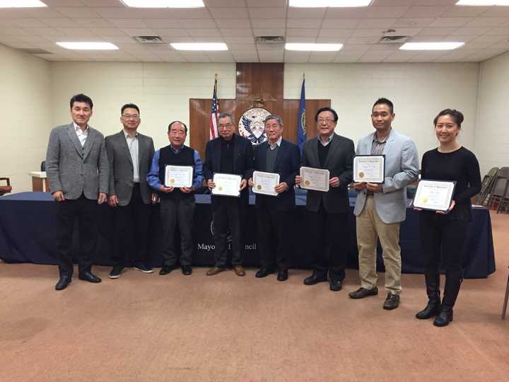 From left to right, Deputy Mayor Jongchul Lee, Council President Christopher Chung, Chun Sik Pak, Andy Nam, Young B. Cho, Jay W. Lee, Danny D. Kim, and Ruby Kim.