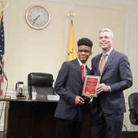 <p>Michael Hunter receives the Youth of the Year Award from White Plains Mayor Thomas Roach.</p>