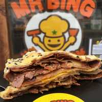 <p>Bings are crepes made with mung bean, rice, and wheat flour and packed with herbs, eggs and meats such as duck, chicken and pork, or sweet fillings such as Nutella, a cocoa-hazelnut paste.</p>