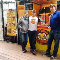 <p>Brian Goldberg, center, with some happy customers at one of his Mr. Bing kiosks. The Spring Valley native and Chinese scholar sells jianbings, a humble street food he got hooked on while living in Beijing.</p>