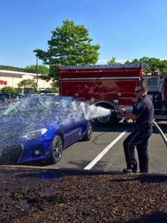 Brookfield Police Officer Helps To Douse Mulch Fire