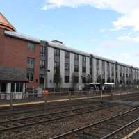 <p>The luxury apartment building was built next to the Waldwick train station.</p>