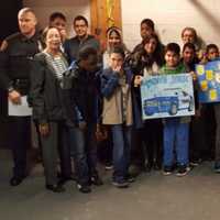 <p>Members of the NRPD greet students from Isaac Young Middle School.</p>