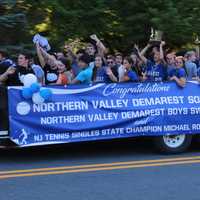 <p>State singles tennis champion Michael Rozenvasser along with the state champion softball and boys swimming team</p>