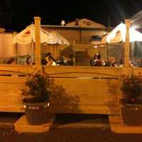 <p>Nellie&#x27;s Place of Waldwick has a fenced-in patio where patrons can enjoy the eatery&#x27;s famed thin-crust pizza and Elkin wings.</p>