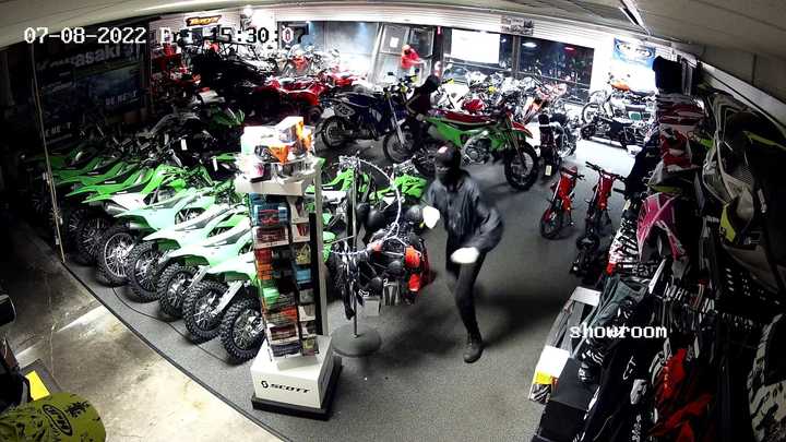 Surveillance image of a suspect in the showroom of the motorbike store