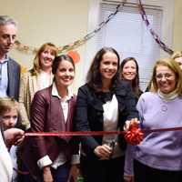 <p>Members of the Junior League of Stamford Norwalk and the Open Door Shelter unveil the new Family Resource Center</p>