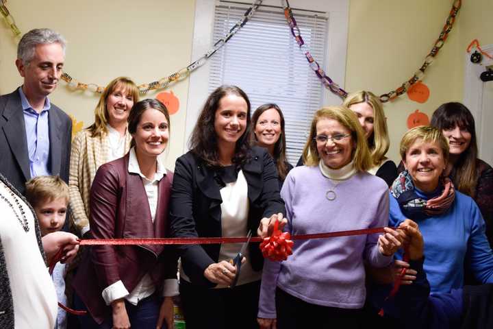 Members of the Junior League of Stamford Norwalk and the Open Door Shelter unveil the new Family Resource Center