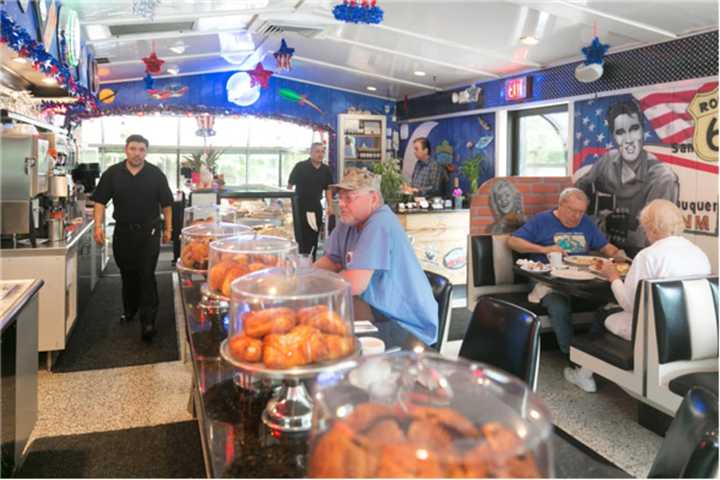 Piles of doughnuts and other pastries sit at eye-level at the Oakland Diner counter.