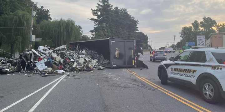 A waste truck overturned along Chatham Heights Road in Stafford on Wednesday, July 6.