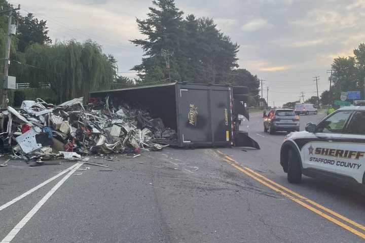 Garbage Truck Overturns In Stafford, Spills Trash On Road: Police