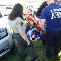 <p>Westport Fire personnel work to free a kitten trapped in a car at the Fairfield County Hunt Club Horse Show Wednesday.</p>