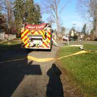 <p>Westport firefighters respond to a dumpster fire on Westfair Drive on Wednesday afternoon.</p>