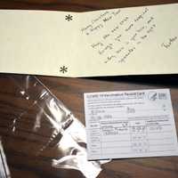 <p>The fake COVID vaccine card was found hidden in a holiday greeting card.</p>