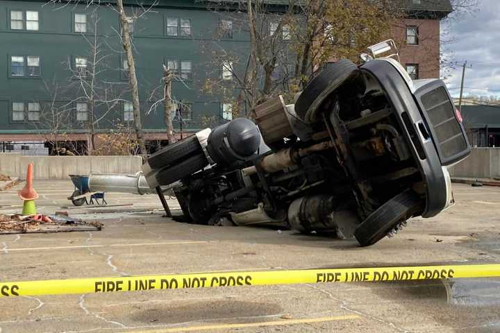 Person Injured After Cement Mixer Falls Through Parking Lot Deck In CT