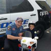 <p>Officer Chris Stanton helped Andrew, 4, celebrate his birthday</p>