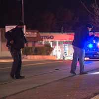 <p>Police inspect the area. Photo by Mark Lieb</p>