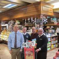 <p>The Pelham Civics Association, with the help of DeCicco &amp; Sons, put together food baskets that will feed hundreds of local residents. From left are: association members Joe Benefico, Joe Nunziata, Rich Davidian, and DeCicco founder John DeCicco Sr. </p>