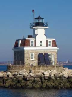 Boat Sinks Near Lighthouse Off Coast Of Fairfield
