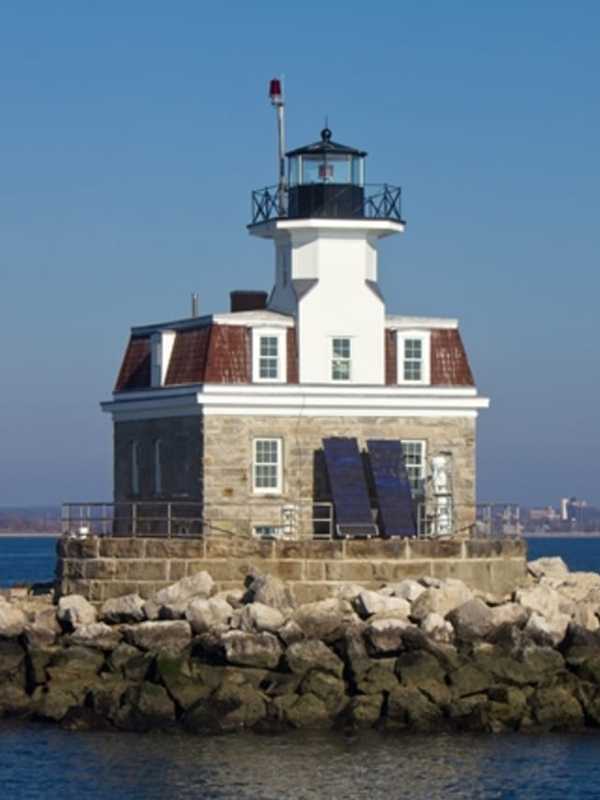Boat Sinks Near Lighthouse Off Coast Of Fairfield