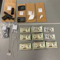 <p>Cash, cocaine and a handgun seized during warrant execution</p>