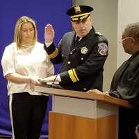 <p>Undersheriff Dave Borzotta is administered the oath of office by Judge Avis Bishop-Thompson</p>