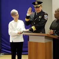 <p>Undersheriff Jin Sung Kim is administered the oath of office by Judge Avis Bishop-Thompson</p>