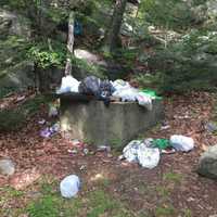 <p>Trash left behind in an old concrete cistern by visitors to Pine Meadow Lake in Harriman State Park.</p>