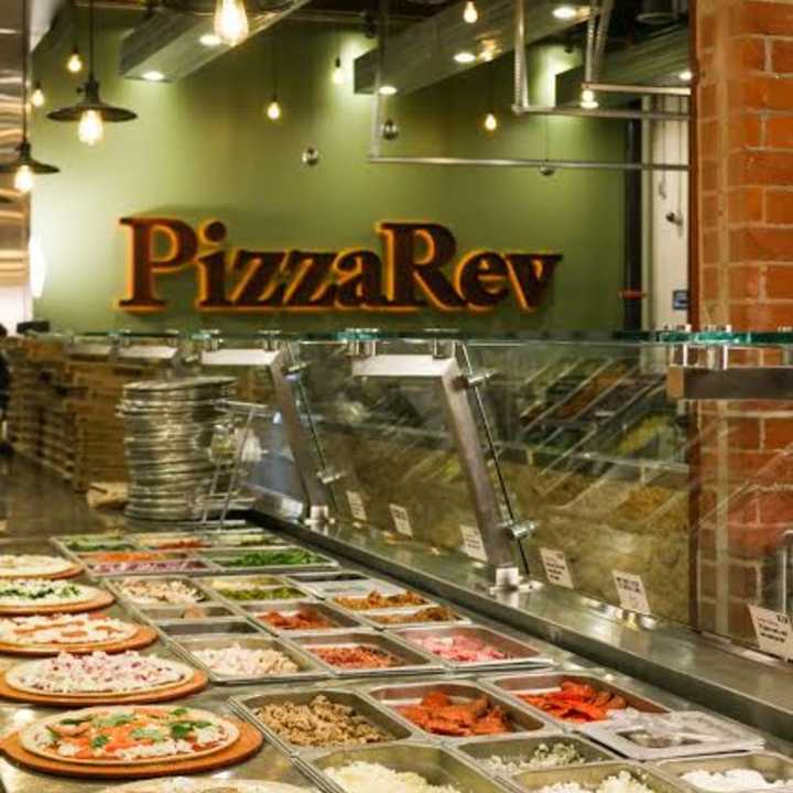 Customers get to choose the fixings for their own pizzas at PizzaRev.