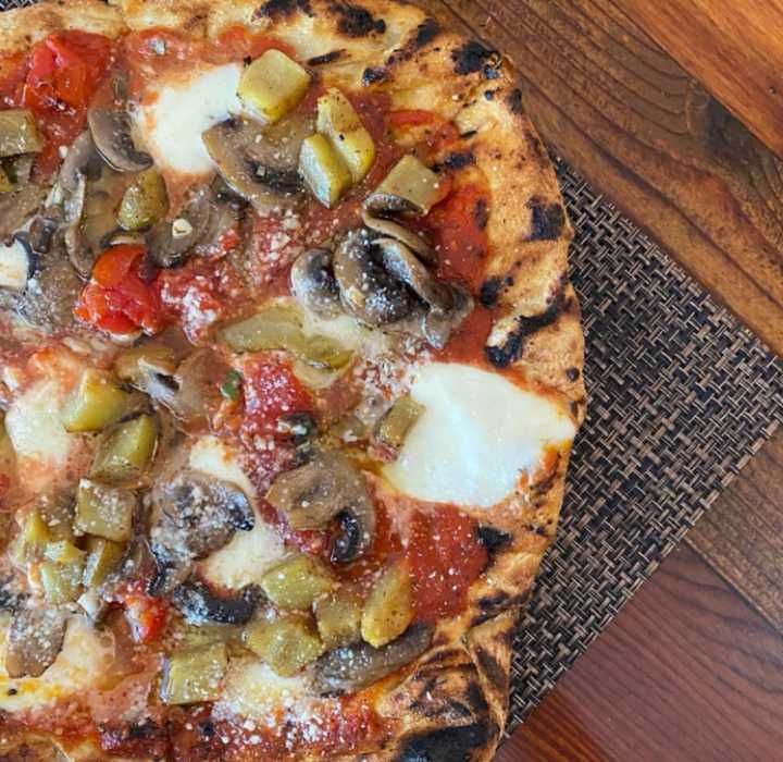 The restaurant&#x27;s &quot;Nicole&quot; Grilled Pizza, made with mushrooms, tomatoes, eggplant and mozzarella