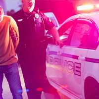 <p>Police Arresting Suspected Drunk Driver</p>